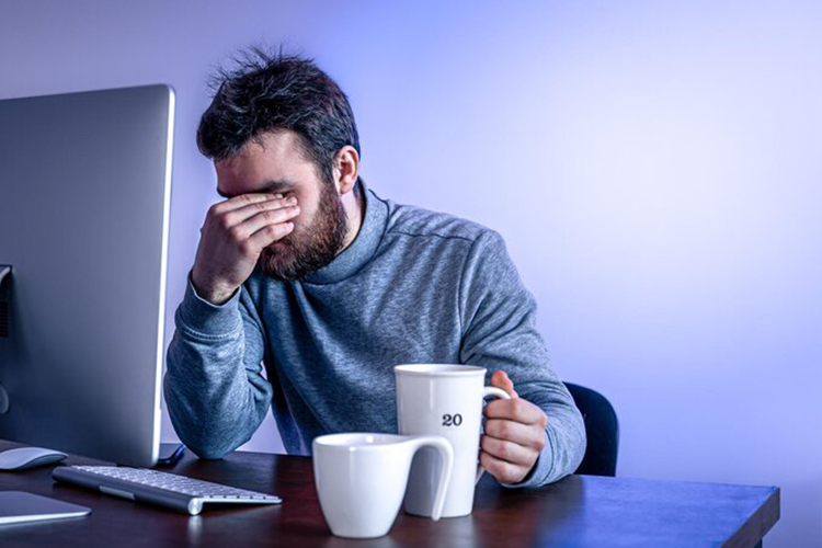 tired-man-sitting-table